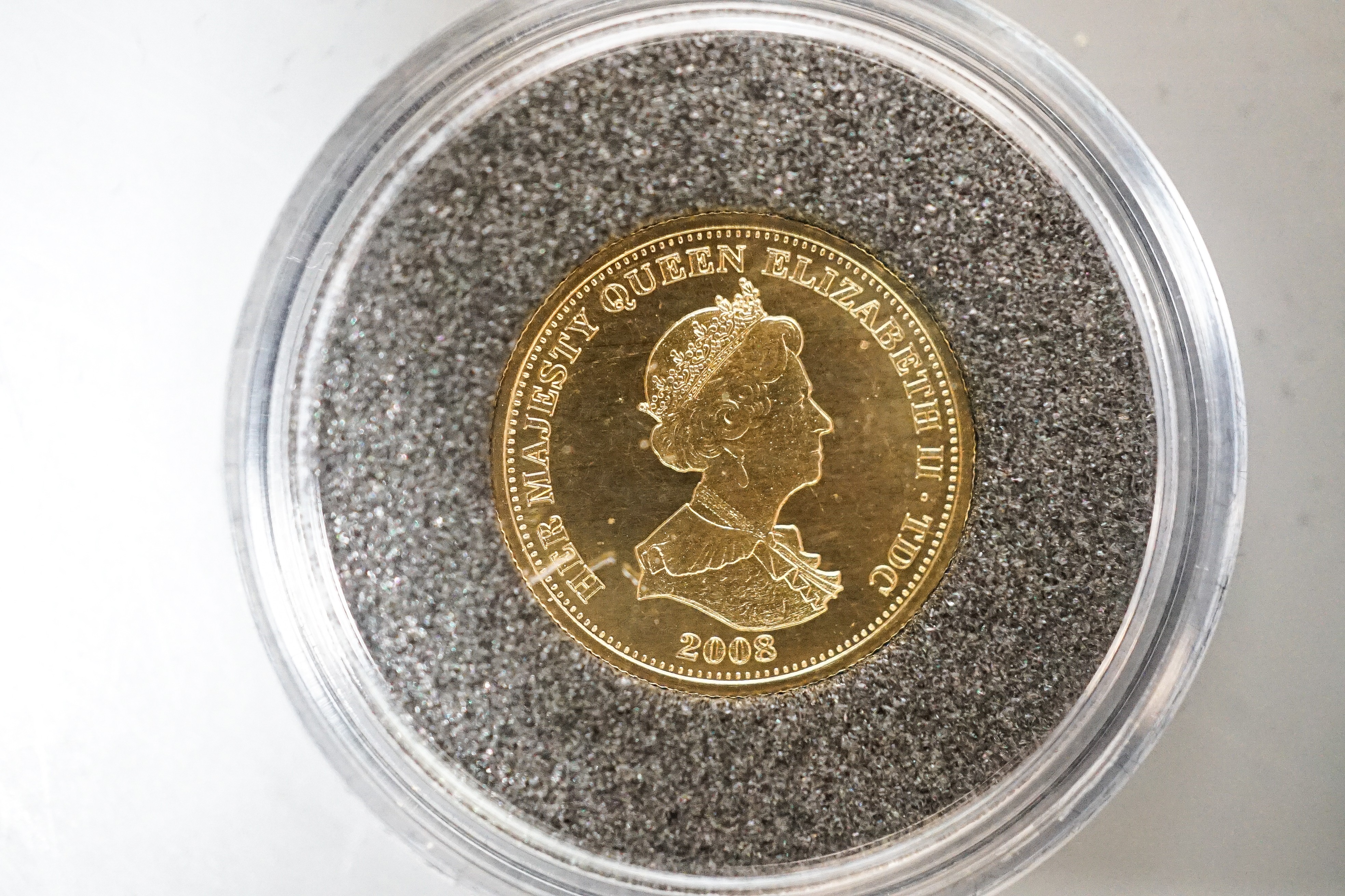 A Queen Elizabeth II gold proof half sovereign 2002 and a London mint Tristan Da Cunha gold piedfort one crown, cased with certificates (2)